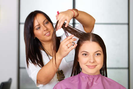 Hair salon. Woman haircut. Cutting.の写真素材