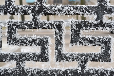 Zigzag cast iron background with frost needles