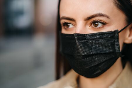 young woman in a protective mask