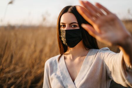Woman in a protective mask while walkingの写真素材