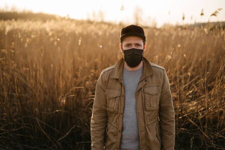 young guy in a protective maskの写真素材