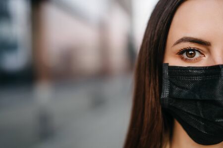 young woman in a protective maskの写真素材