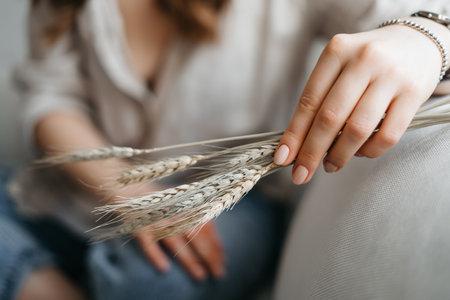 close-up photo of female hands holding spikelets. High quality photo