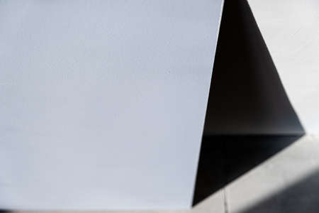 black shadow in the form of a triangle on a concrete wall. background, abstraction. Gray.の写真素材