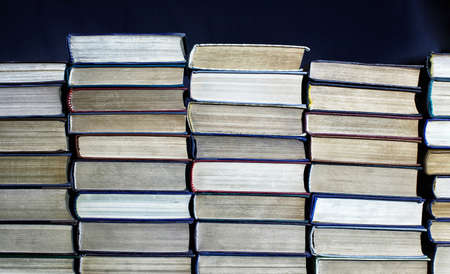 Big pile of books on dark backgroundの写真素材