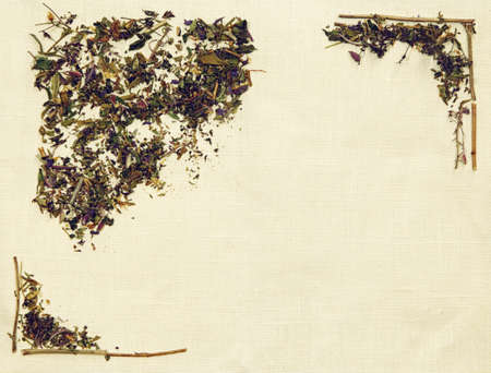 Herbal flat lay of different herbs on linen fabricの写真素材
