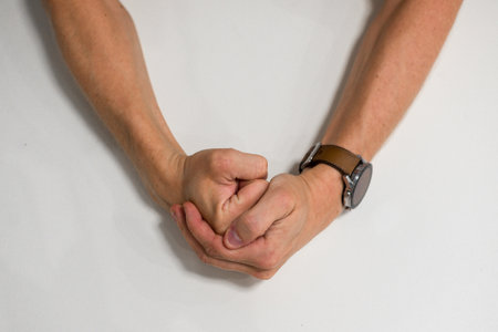 Close-up of a man fist. Strong and power mans hand with smart watch.の写真素材