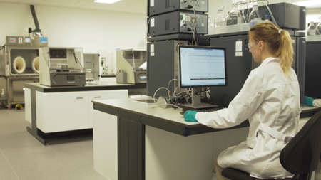 Scientists in the laboratory in front of computers do scientific research. Female researcher working...