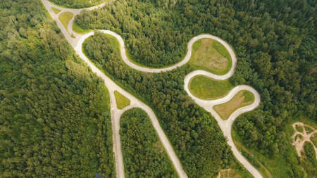 Aerial view Simulation of the mountain road for vehicle testing.Test road in the forest for testing and fine-tuning cars.の写真素材