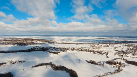 Winter forest, field. Aerial view Winter landscape countryside, forest, field. Winter landscape, field, forest, trees covered with frost snowの写真素材