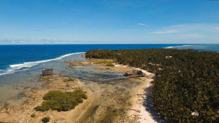 Viewpoint in the ocean at Cloud Nine surf point, Siargao island , Philippines. Aerial view raised...