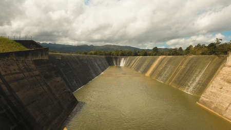 Aerial view Dam on the lake in the rainforest on the island. Water flowing from the dam, Water for...