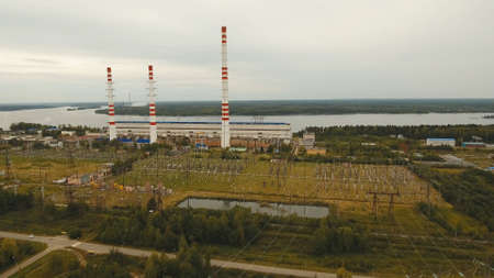 Aerial view Hydroelectric power station, transformation station, cables and wires. High voltage electric power substation. Electrical power transformer in high voltage substation.の写真素材