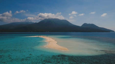 Aerial view of beautiful sand tropical island with white sand beach, Camiguin. White sand island....
