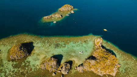 Aerial view: beach, tropical island, sea bay and lagoon, Palawan. Lagoon with blue, azure water in...
