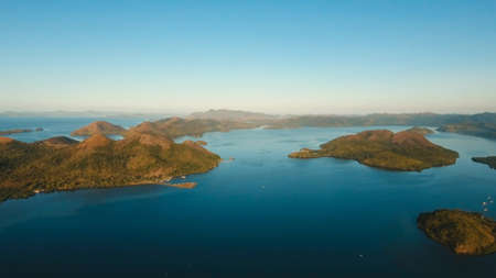 Aerial view: beach, tropical island, sea bay and lagoon, mountains with rainforest, Busuanga, Palawan. Seascape, tropical landscape. Azure water of lagoon Philippinesの写真素材