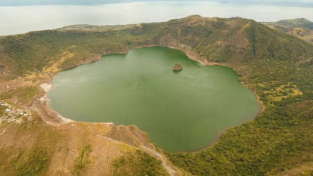 Aerial view Lake crater at Taal Volcano on Luzon Island North of Manila in Philippines. Volcano with a crater on an island in the middle of a lake. Luzon, Philippines. Travel concept.の写真素材