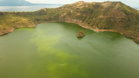 Aerial view Lake crater at Taal Volcano on Luzon Island North of Manila in Philippines. Volcano with a crater on an island in the middle of a lake. Luzon, Philippines. Travel concept.の写真素材