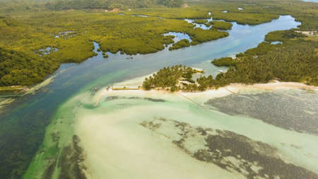 Aerial view of tropical beach on the island Siargao, Philippines. Beautiful tropical island with...