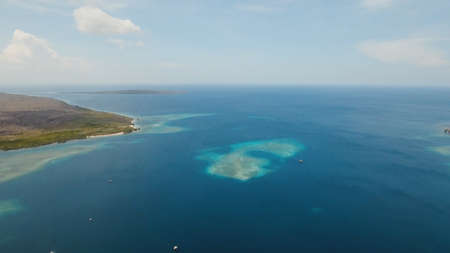 Aerial view coral reef, atoll with turquoise water in the sea.Tropical atoll, coral reef in ocean...