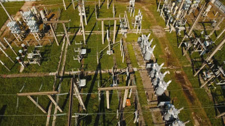 Aerial view Power plant, transformation station, cables and wires. High voltage electric power...