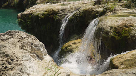Waterfall in green rainforest. Bolinao waterfall in the mountain jungle. Philippines, Luzon. Travel concept.の写真素材