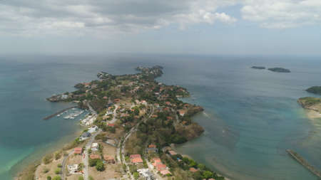 Aerial view of coast with beach, hotels. Philippines, Luzon. Coast ocean with tropical beach,...