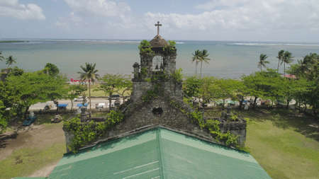 Old, ancient St Joseph church in the city of Barcelona, Sorsogon, Philippines. Church in the Spanish style on the coast near sea.の写真素材