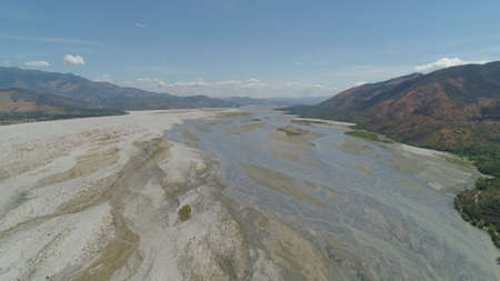 Parched river in mountain province Luzon, Philippines. Aerial view Drought in mountain valley, dry...