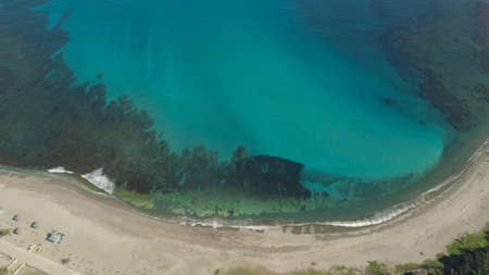 Aerial view of beautiful beach, lagoon and coral reefs. Philippines, Pagudpud. Ocean coastline with...