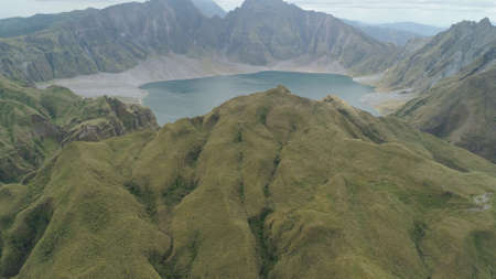 Crater lake of the volcano Pinatubo among the mountains, Philippines, Luzon. Aerial view beautiful...