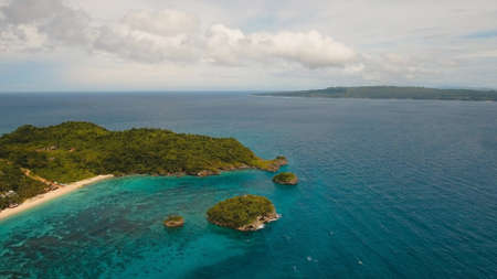 Aerial view of beautiful tropical island with white sand beach, hotels and tourists, Boracay....