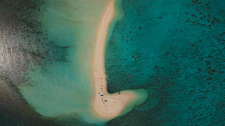 Aerial view of beautiful sand tropical island with white sand beach, Camiguin. White sand island. Beautiful beach, sea. Seascape: ocean and beautiful beach paradise. Philippines. Travel concept.の写真素材