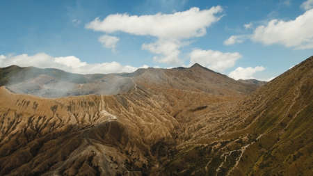 Crater with active volcano smoke in East Jawa, Indonesia. Aerial view of volcano crater Mount Gunung...