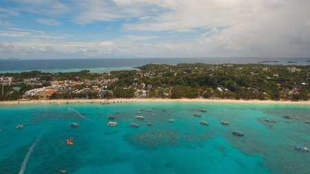 Aerial view of beautiful tropical island with white sand beach, Boracay, hotels and tourists....