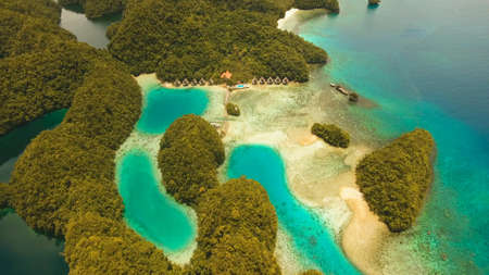 Aerial view: Bucas Grande Island, Sohoton Cove. Philippines. Tropical sea bay and lagoon, beach. Tropical landscape hill, clouds and mountains rocks with rainforest. Azure water of lagoon. Shore Landscape Bay. Aerial video.Seascape. Travel concept.の写真素材