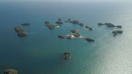 Aerial view of Small islands with beaches and lagoons in Hundred Islands National Park, Pangasinan, Philippines. Famous tourist attraction, Alaminos.の写真素材