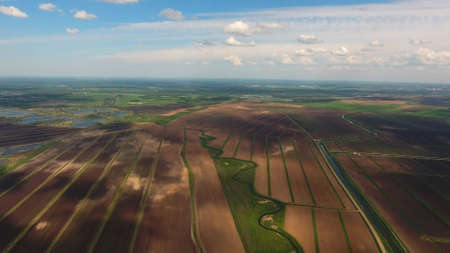 Aerial view of agricultural, cultivated fields. Agricultural landscape. Irrigated farmland