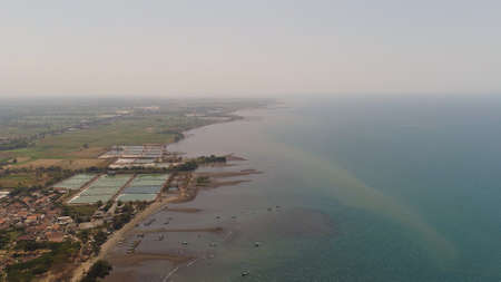 aerial tropical landscape coastline town by sea, beach, boats on surface water. Bali,Indonesia, travel concept.の写真素材