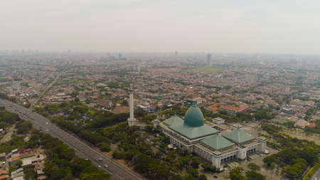 aerial view cityscape city Surabaya with mosque Al Akbar, highway, skyscrapers, buildings and...