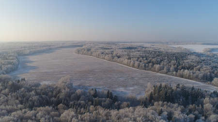 aerial view winter landscape snow covered field and trees in countryside. winter in countryside....