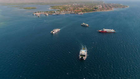 Aerial view ferry port gilimanuk with ferry boats, vehicles. Ferries transport vehicles and passengers in port. Port for departure from Bali to the island of Java.の写真素材