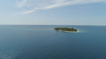 Tropical island with white sandy beach. Aerial view: Putipot island with colorful reef. Seascape,...