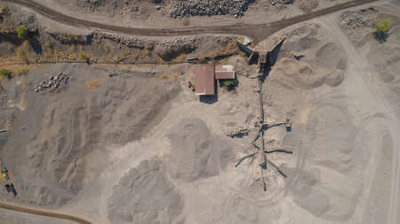 Heavy machinery at gravel and sand quarry. extraction volcanic sand at sorting crushing complex....