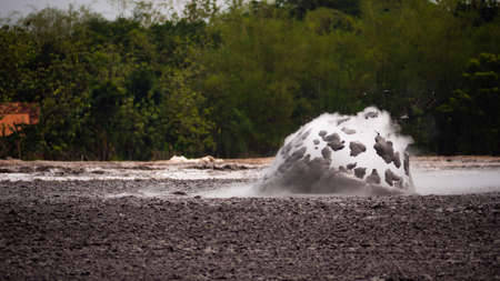 mud volcano with bursting bubble bledug kuwu. volcanic plateau with geothermal activity and geysers,...