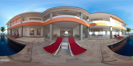 vr 360 swimming pool in luxury hotel with sun beds by sea. tropical resort with pool. Travel concept.の写真素材