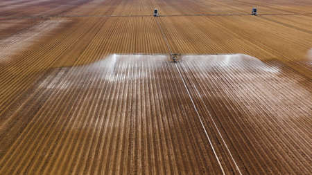 aerial view Center pivot agriculture irrigation machine of crops. An irrigation pivot watering...