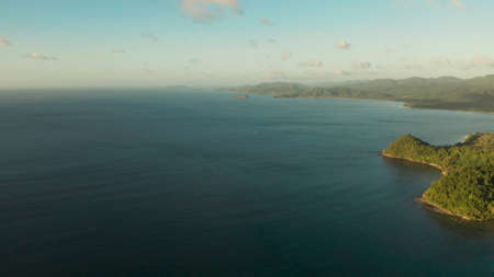 Aerial view coastline of tropical island and sea at sunrise. El nido, Palawan, Philippines....
