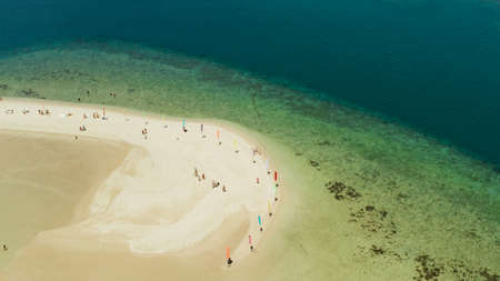 Beautiful beach on tropical island surrounded by coral reef, sandy bar with tourists. honda bay top view. Luli island. Summer and travel vacation concept, Philippines, Palawanの写真素材