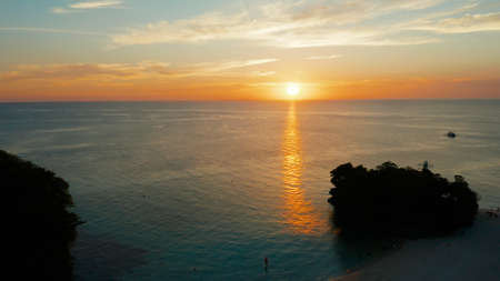 Colorful bright clouds during sunset over the sea, aerial view. Sunset over ocean. Boracay,...